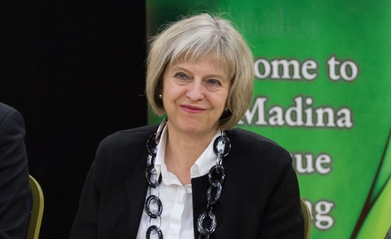 Image ©Licensed to i-Images Picture Agency. 12/02/2015. Barking, United Kingdom. Theresa May visits Al Madina Mosque. The Home Secretary Theresa May meets with students from the Young Leaders Programme, spiritual leaders, and community representatives in a visit to Al Madina Mosque in East London. Picture by Daniel Leal-Olivas / i-Images