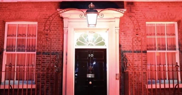 10 Downing Street lit up in red