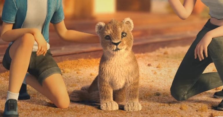 lion cub being petted by tourists