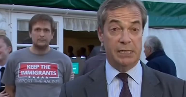 Nigel Farage photobombed by protester in Sedgefield