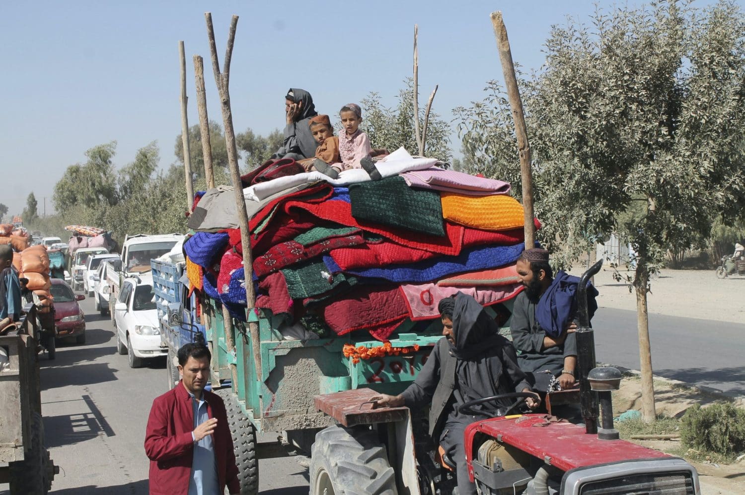 People in Afghanistan on a tractor