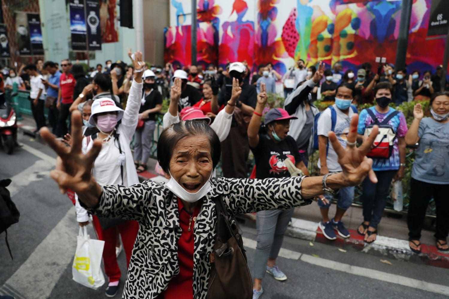 Protesters holding three fingers up