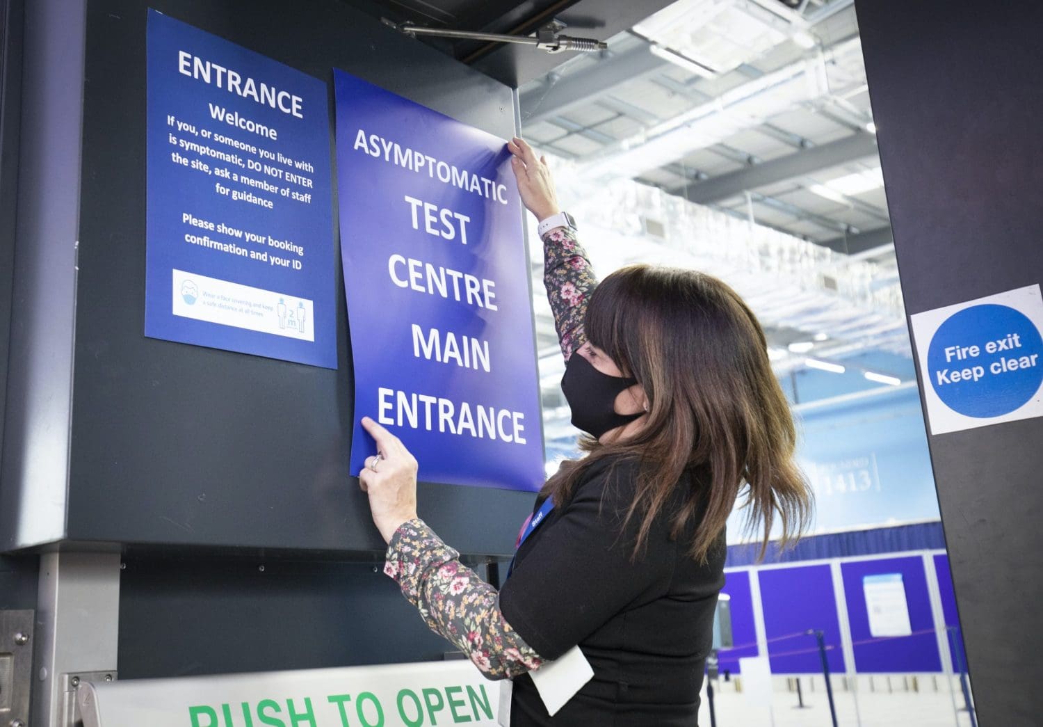 Masked worker in a testing centre