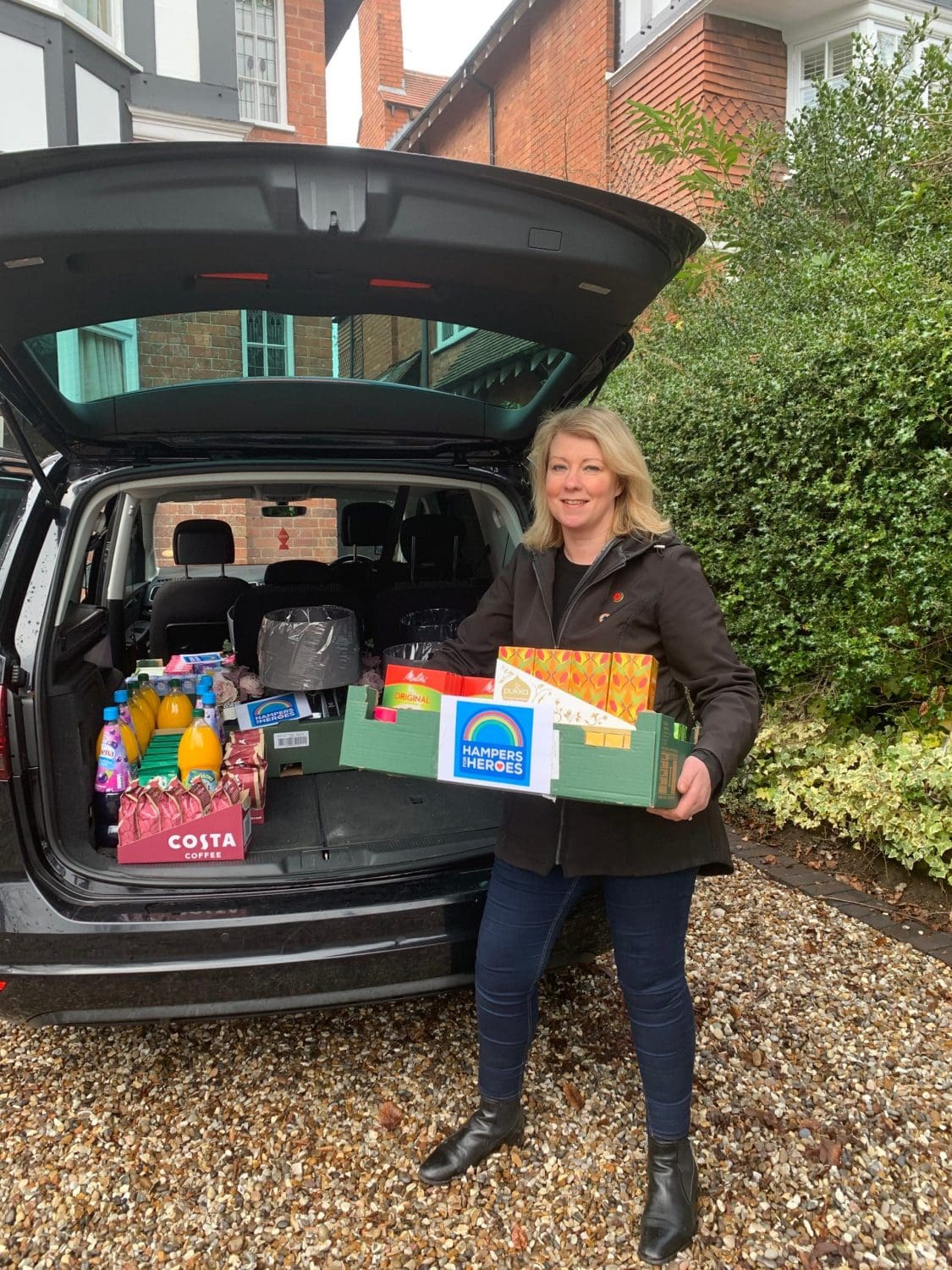 Victoria Hanson holding a box of donations