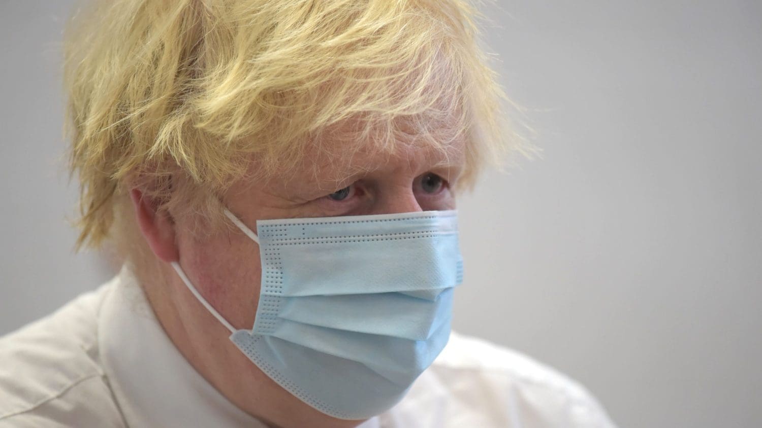 Boris Johnson wearing a mask