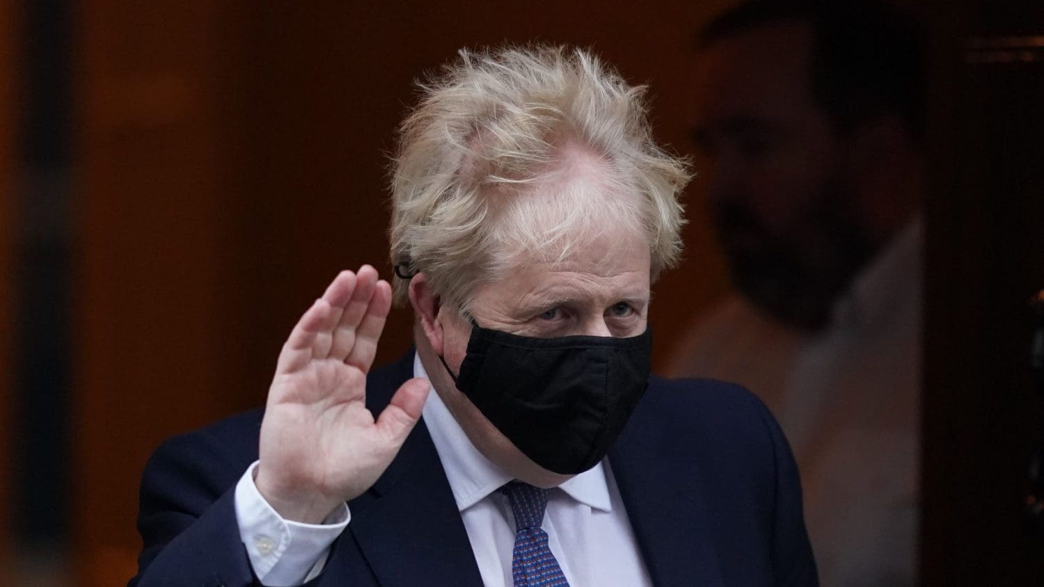 Boris Johnson waving his hand