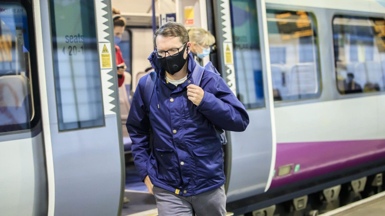 Commuters disembarking a train