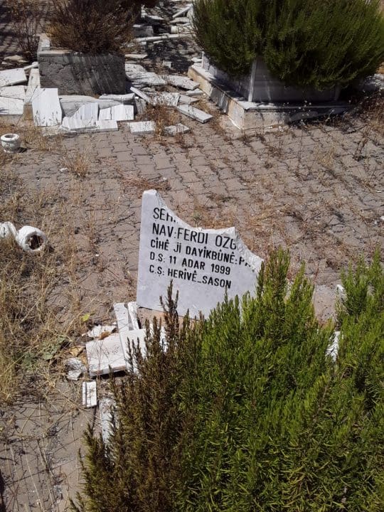 A defaced grave in a Kurdish graveyard
