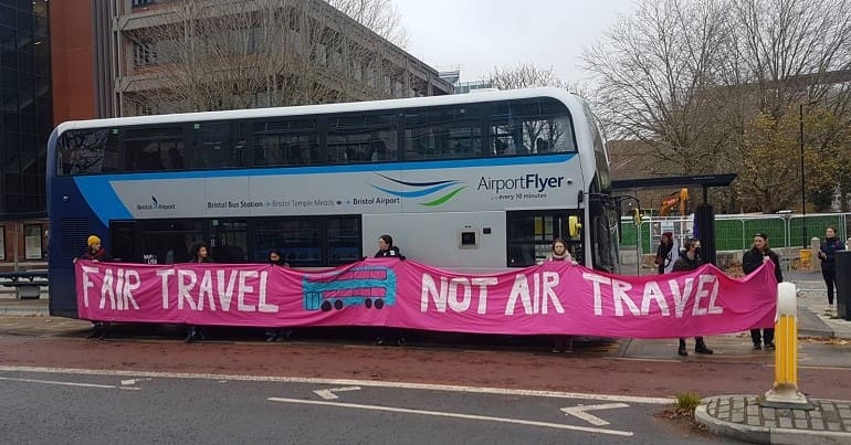 XR Youth Bristol blocking an airport shuttle bus