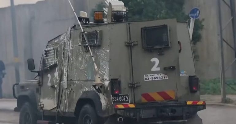 An Israeli vehicle equipped with a tear gas launcher invading Aqbat Jaber Camp (February 2023)