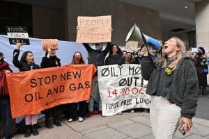 Climate activists including Fossil Free London disrupt the Energy Intelligence Forum, London, UK