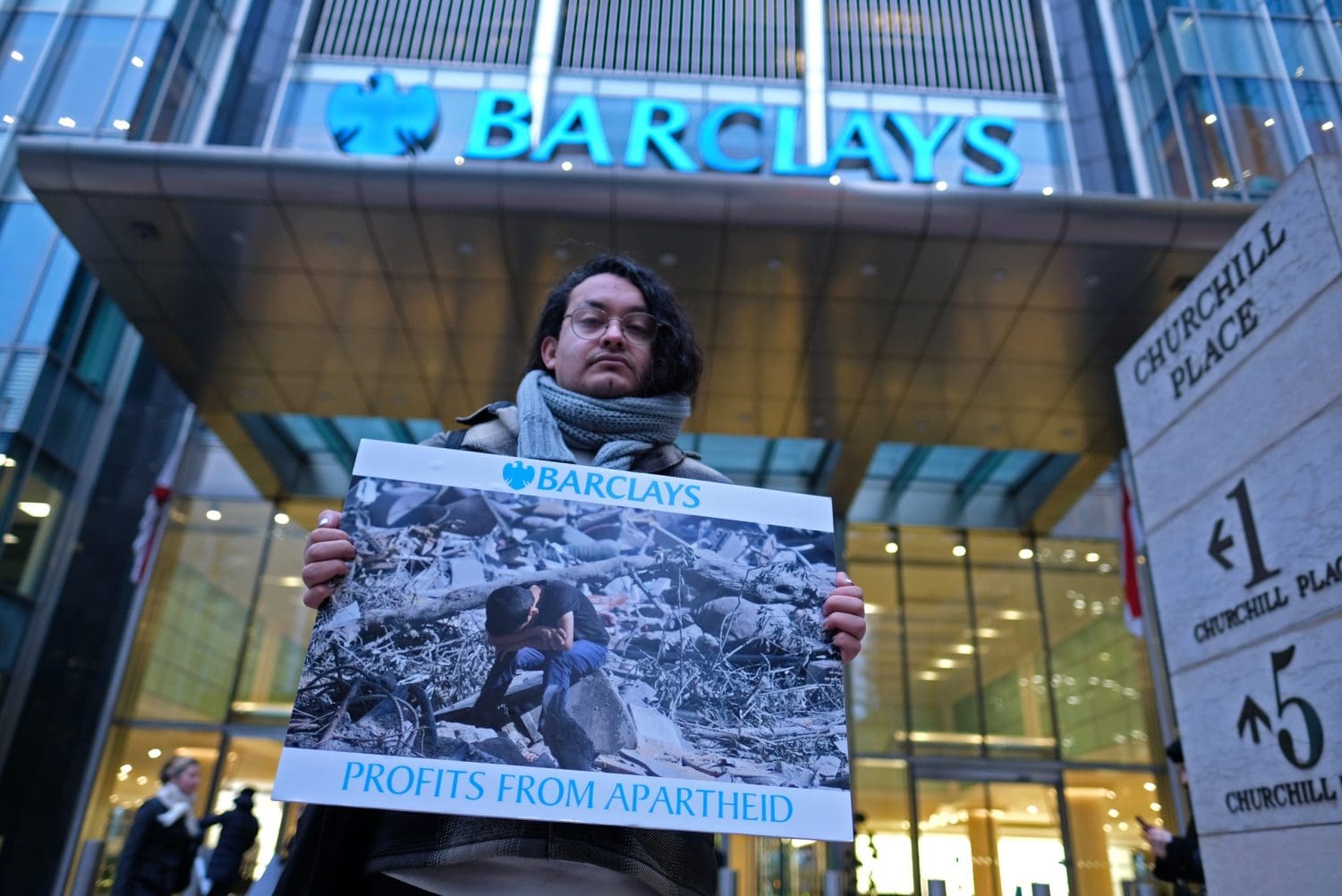 An activist holding a sign