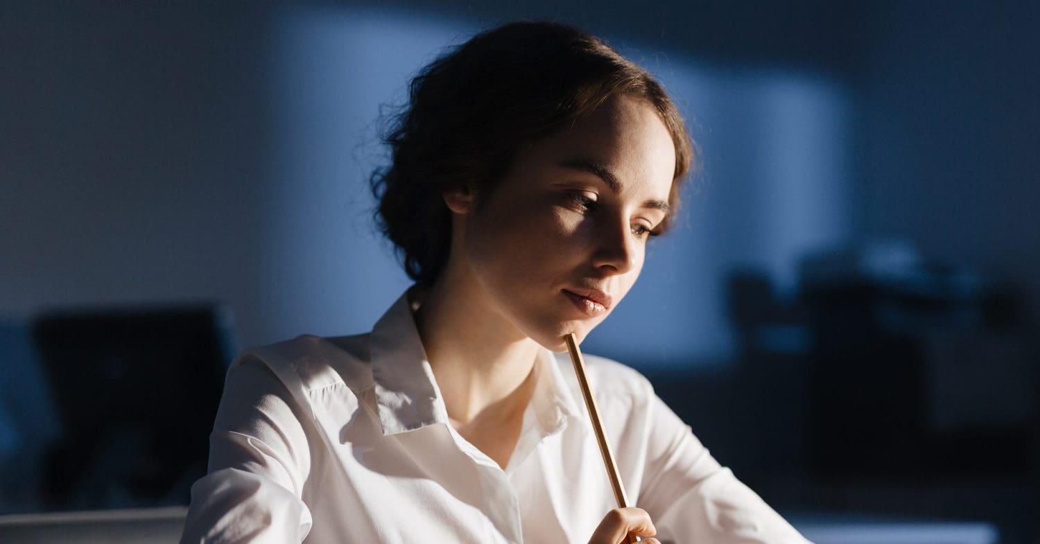 Writing a good essay woman with pencil on her chin