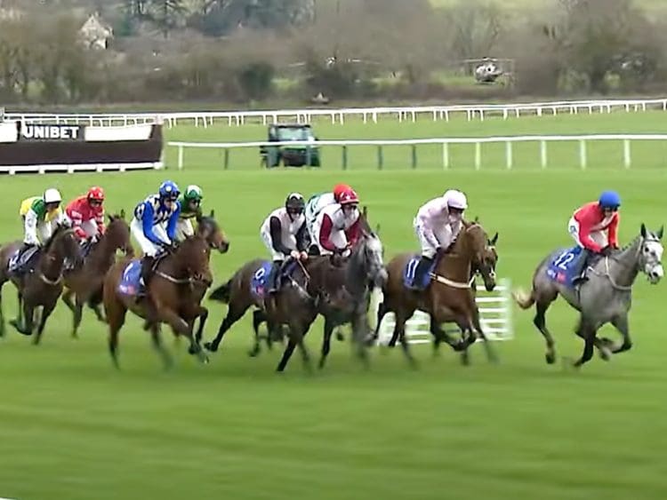 Cheltenham Festival horses racing with jockeys