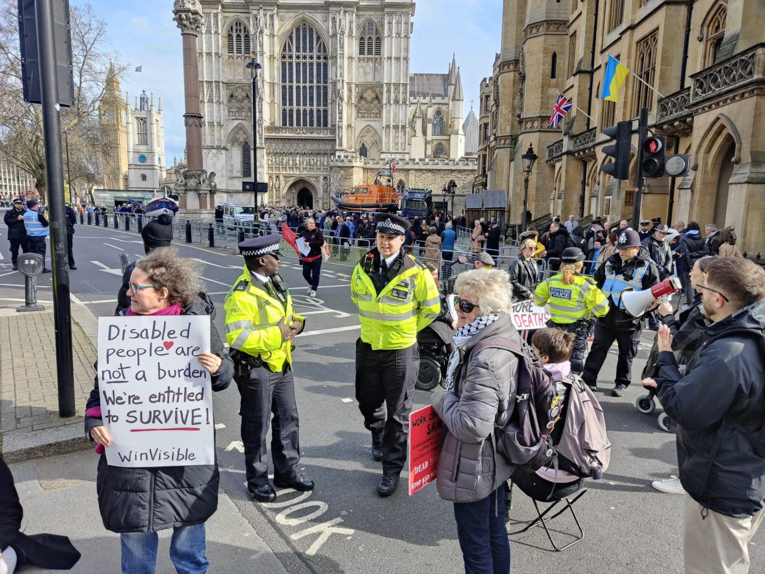 police trying to move disabled people off a road DWP DPAC