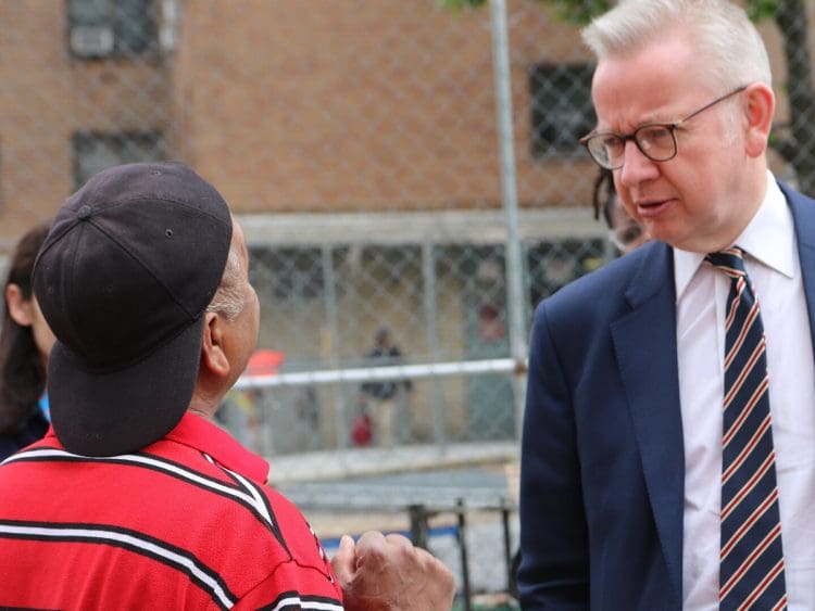 Michael Gove staring at a man extremism definition