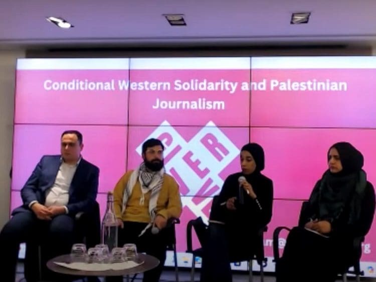 Panelists speak at the Give Over event in London on "Conditional Western Solidarity and Palestinian Journalism".