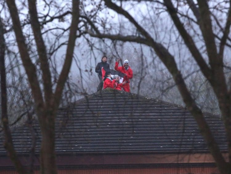 Palestine Action on the roof of Teledyne arms manufacturer that supplies Israel