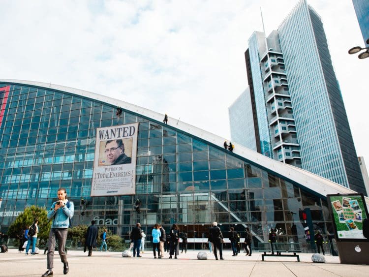 Greenpeace France activists unfurl a giant portrait of Patrick Pouyanné, CEO of the TotalEnergies with a word "Wanted" at the heart of La Défense, in France, near the headquarters of the French oil and gas company, where the annual general meeting (AGM) of shareholders is taking place.