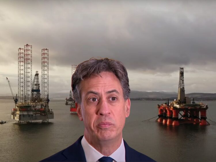 Ed Miliband with three offshore oil rigs behind him Rosebank