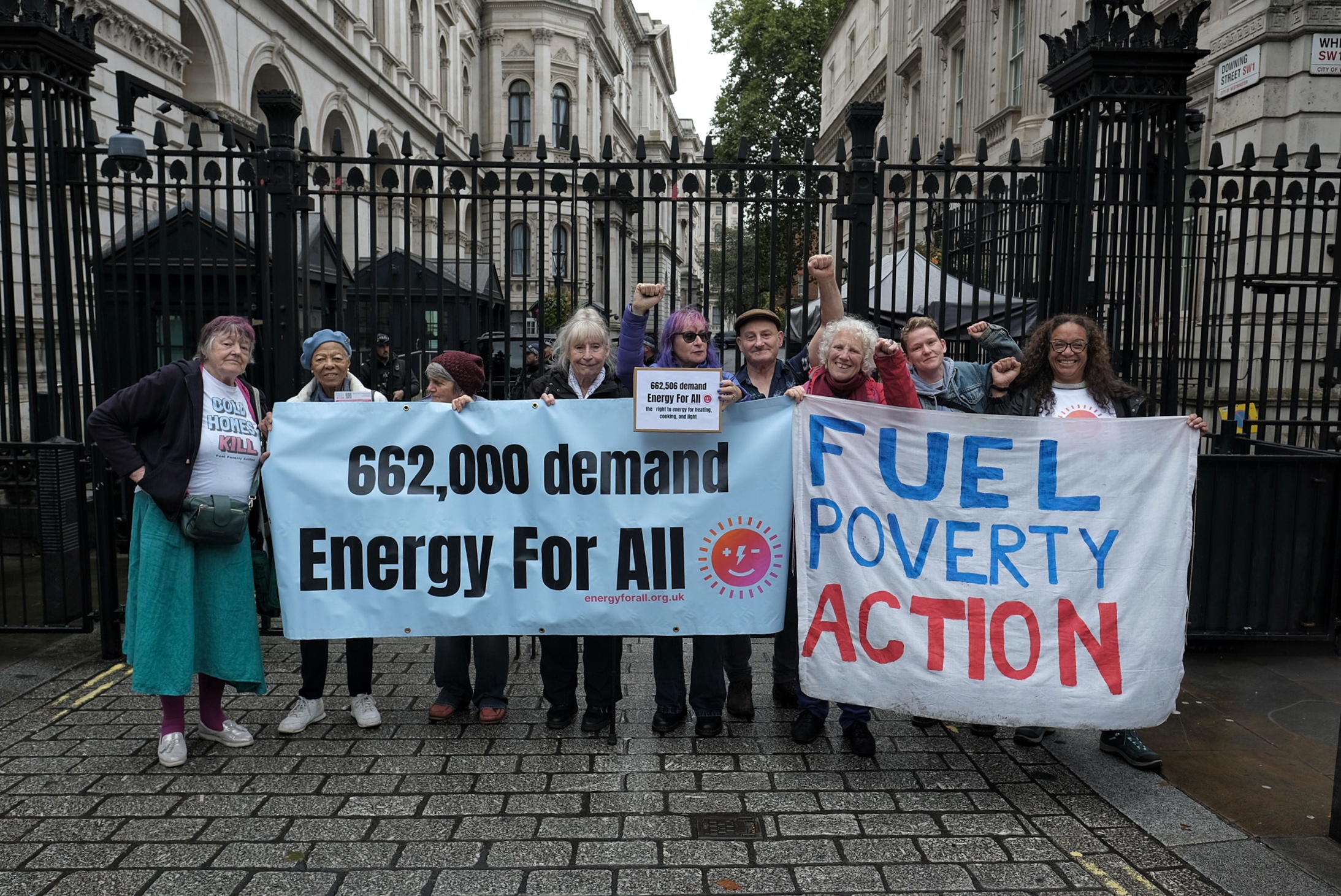 Group of campaigners with banners that read: 662,000 demand Energy For All. And: Fuel Poverty Action.