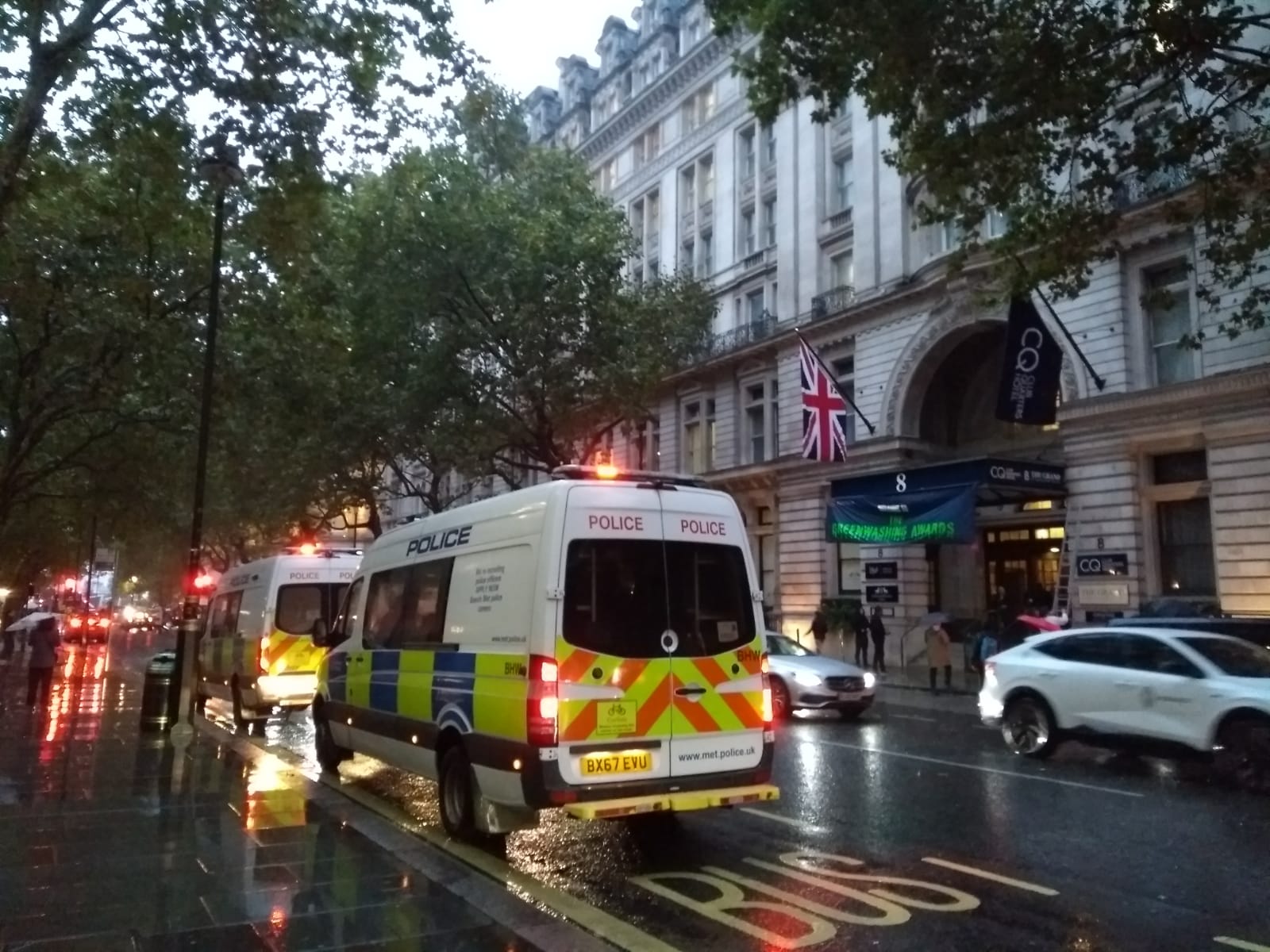 Two cop vans gather outside the event. 