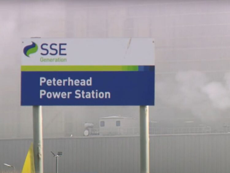 Sign for SSE Peterhead Power Station, with smoke in the background carbon capture and storage